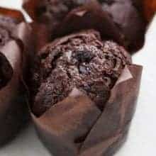 close up Chocolate Zucchini Cupcakes with brown cupcake liners on white background