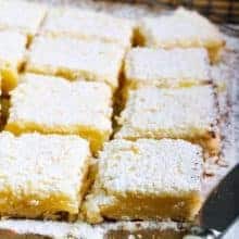 close up slices of Lemon Bars with icing sugar on top