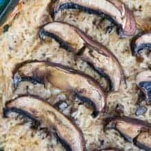 close up of Rice & Mushroom Casserole with large baked mushrooms on top