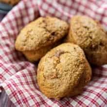 close up of Carrot Bran Muffins on a red checkered cloth