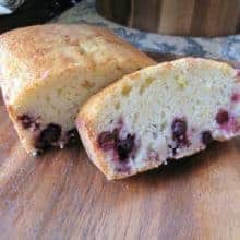 sliced Lemon Saskatoon Loaf in a wood board