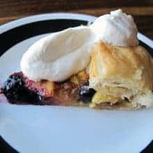 Simple & Easy Peach Blueberry Galette topped with whipped cream