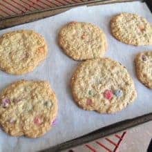 Baked Smartie Oatmeal Cookies in Cookie Sheets with Parchment Paper