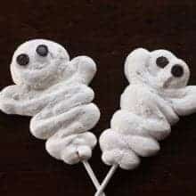 2 pieces ghosts shaped white Meringue Halloween Treats with sticks