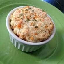 Mini Chicken and Biscuit Pot Pies in White Ramekins on green background