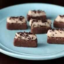 close up of Cheesecake Bites with Chocolate Sprinkles on Top in a Blue Plate