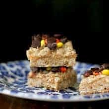 Oatmeal Dream Bars with creamy peanut butter filling in a blue plate