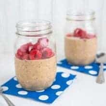 Spiced Chocolate Raspberry Refrigerator Oatmeal on Jars with Blue Paper Underneath