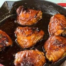 Close up of honey garlic chicken in a cast iron skillet