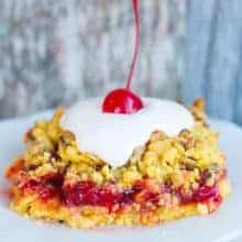 Close up of a Lemon Cherry Crunch Cake on a white plate