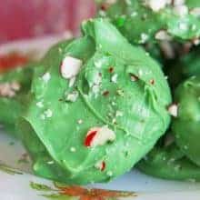 Minty Grinch Crock Pot Candy sprinkled with broken candy cane