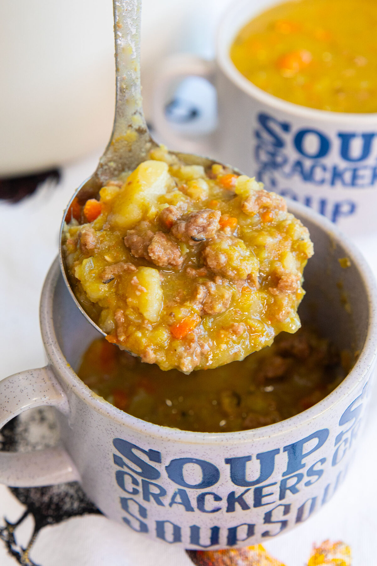 a ladle full of split pea hamburger soup