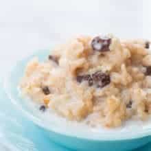 Close up of Instant Pot Rice Pudding in a Jade blue bowl