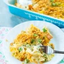 Chicken and Egg Noodle Casserole with Ritz Topping on a white plate and a fork in it