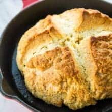 Close up of Irish Soda Bread in Large Red Skillet