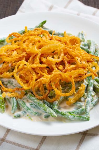 close up Asparagus Green Bean Casserole in a white plate