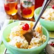 Close up of Ambrosia Salad ( 5 Cup Salad) in a bowl with a spoon in it