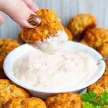 dipping a sausage ball in dipping sauce