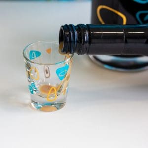 Pouring Irish cream into a shot glass