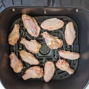 Chicken wings evenly spaced in the air fryer