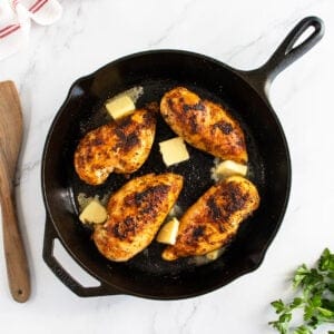 Pan fried chicken breast in fying pan