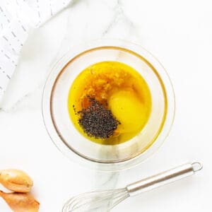 poppy seed dressing in a clear bowl not mixed