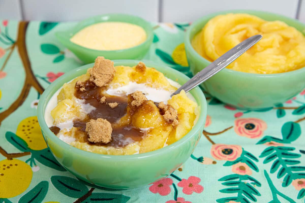 cornmeal porridge or mush in a jadeite bowl with a spoon.