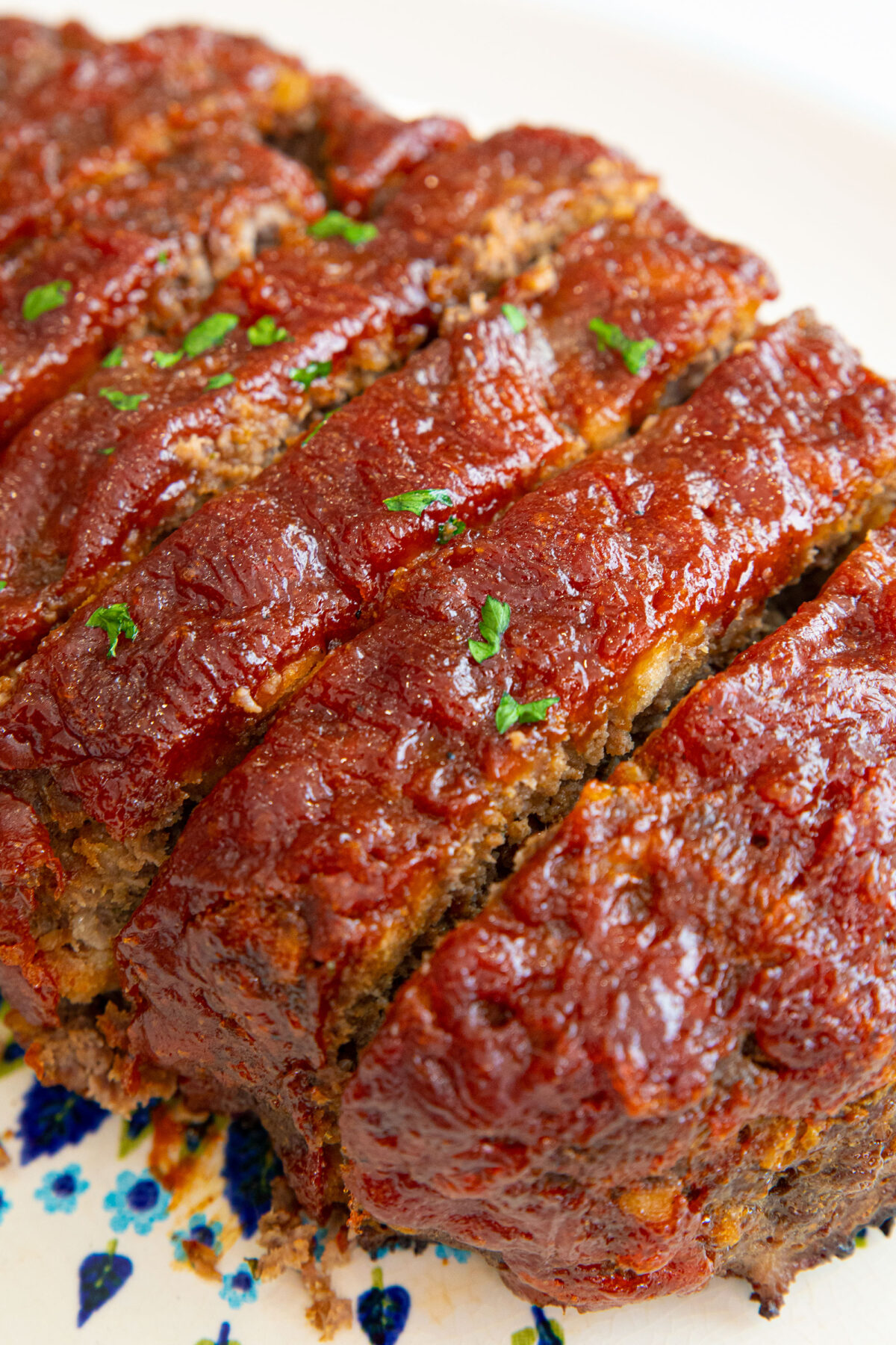 meatloaf sauce on top of sliced meat loaf.