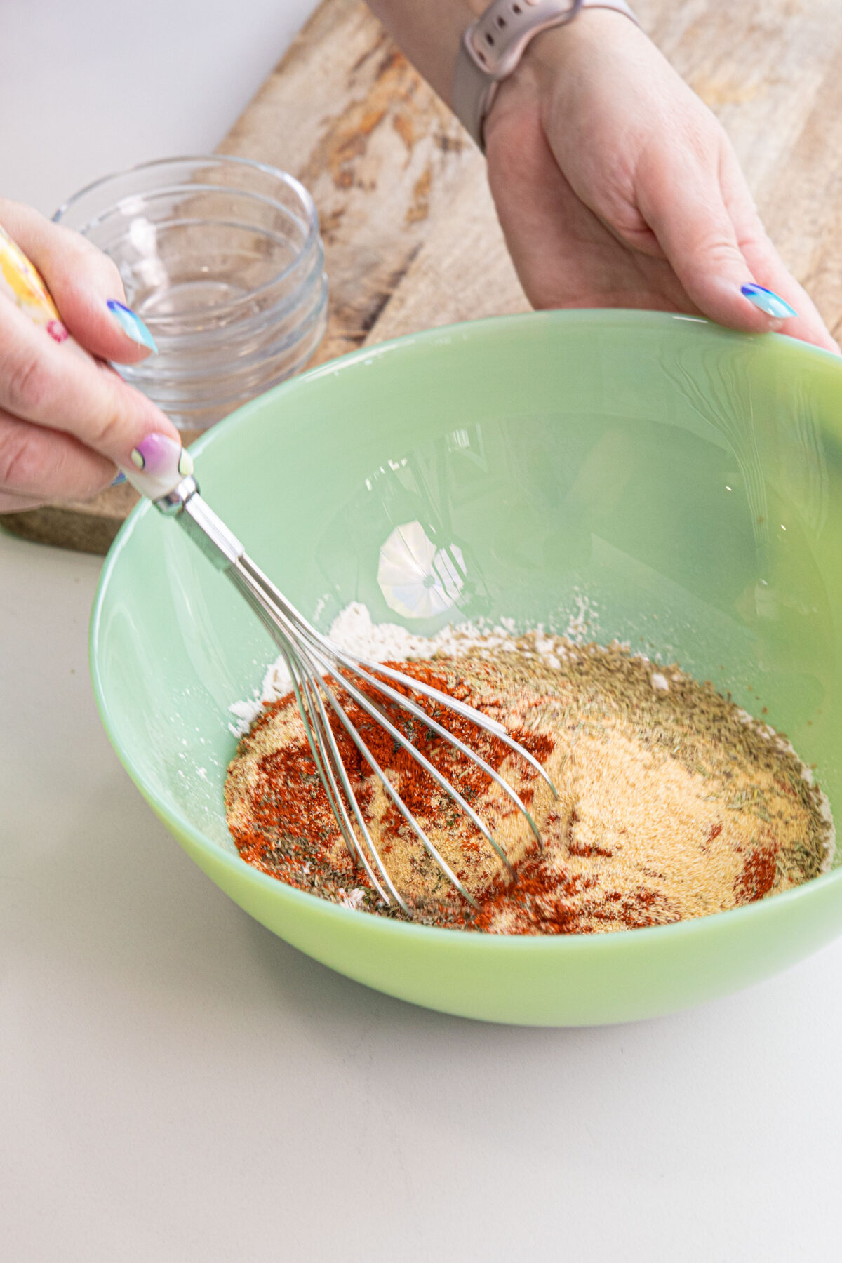 whisking spices for beef seasoning in a bowl