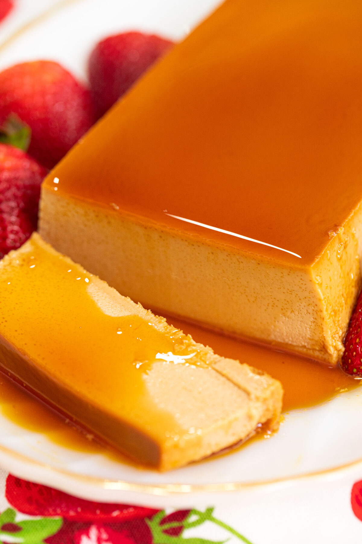 close up of a slice of flan