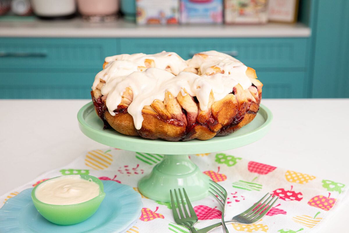 Cherry Cheesecake Pull Apart Loaf on a green cake stand 