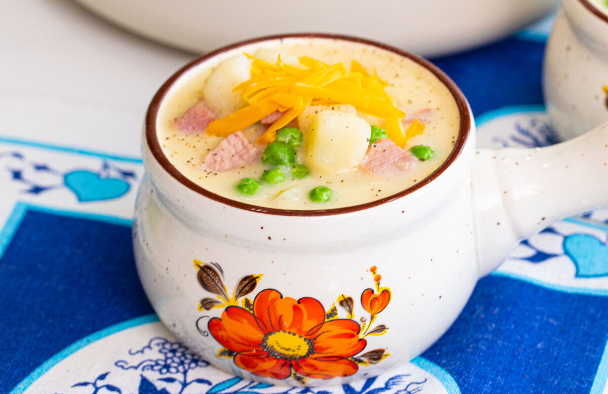ham and potato soup with cheddar cheese shredded on top