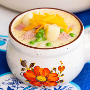 ham and potato soup with cheddar cheese shredded on top