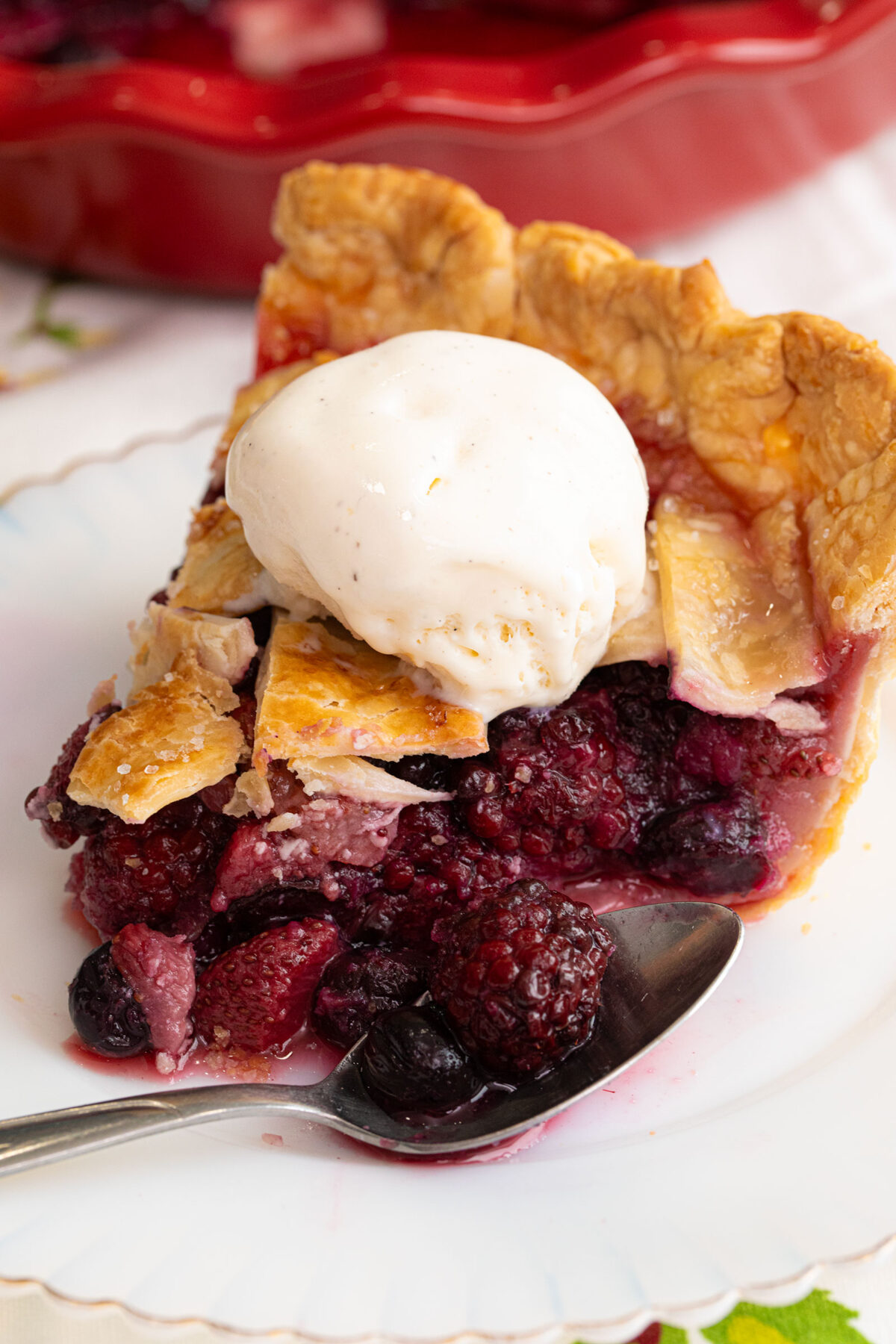 slice of mixed berry pie on a plate