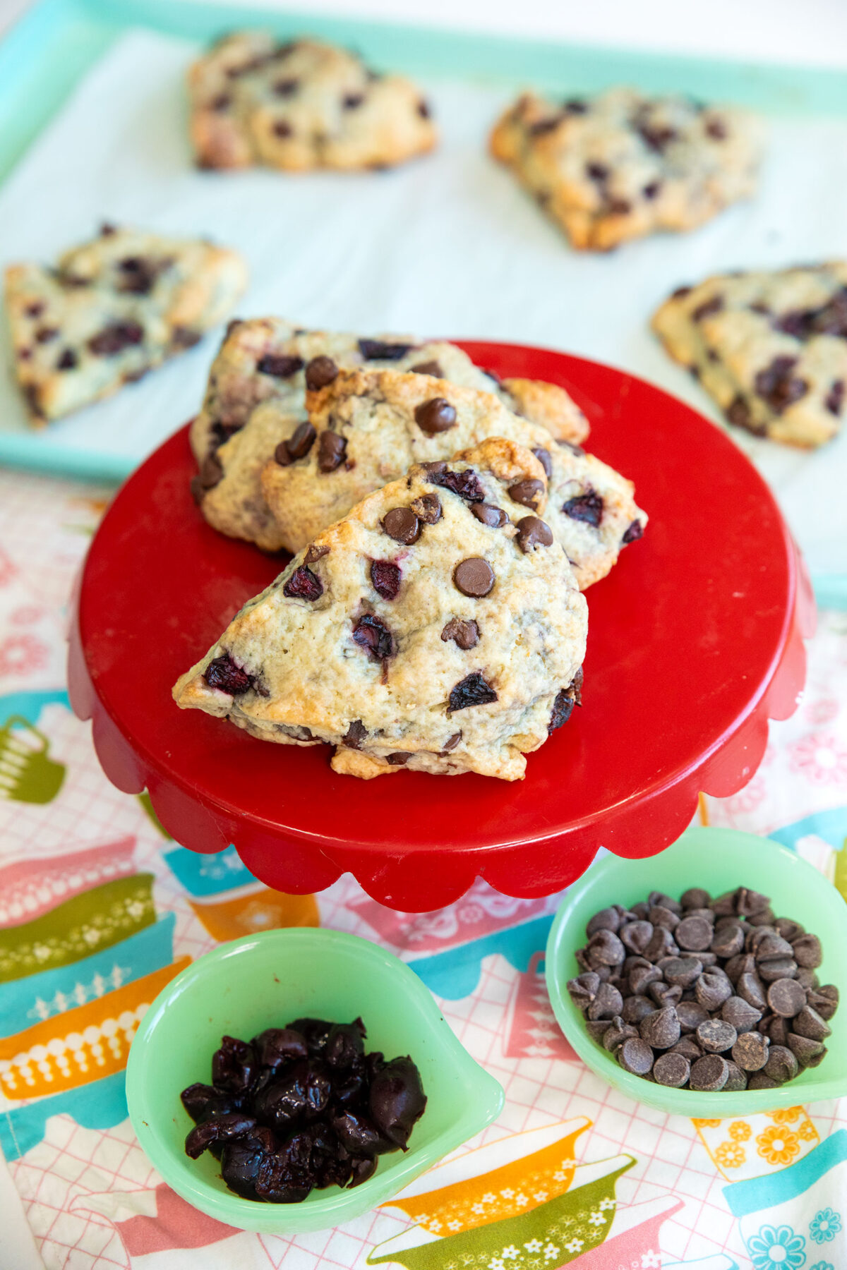 cherry scones with chocolate chips on a red platter