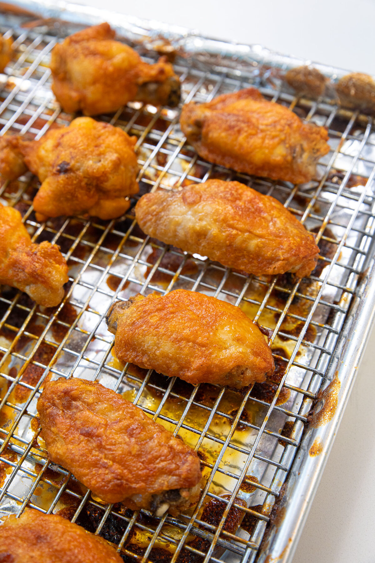 baked buffalo chicken wings on a wire baking rack