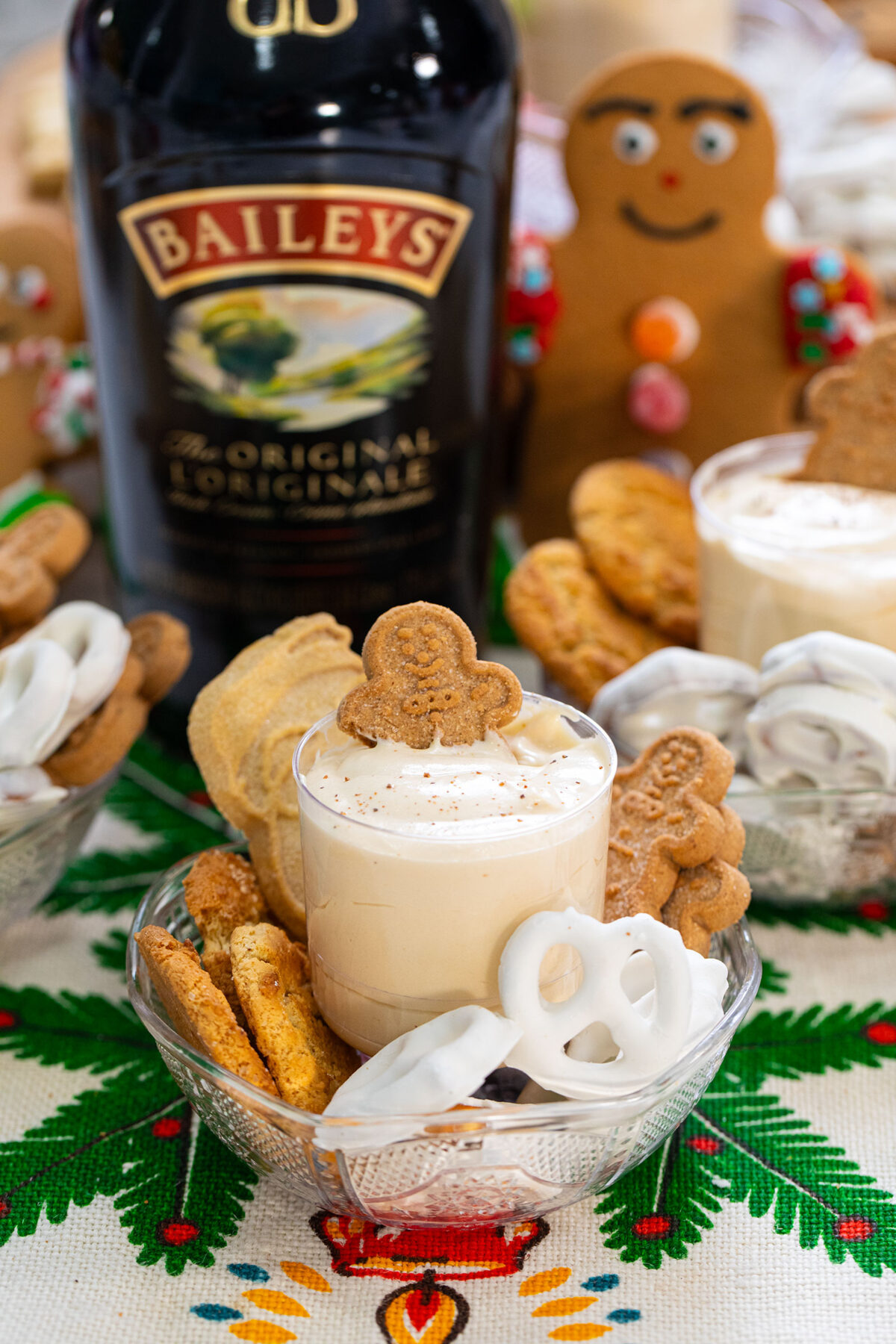 Baileys and eggnog dip in a small bowl with ginger cookies