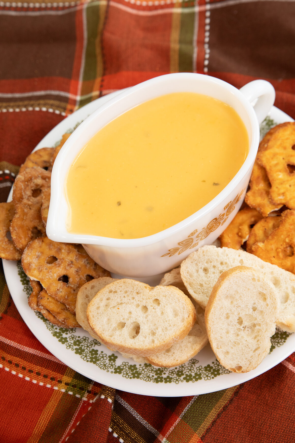 beer cheese sauce in a Pyrex gravy boat