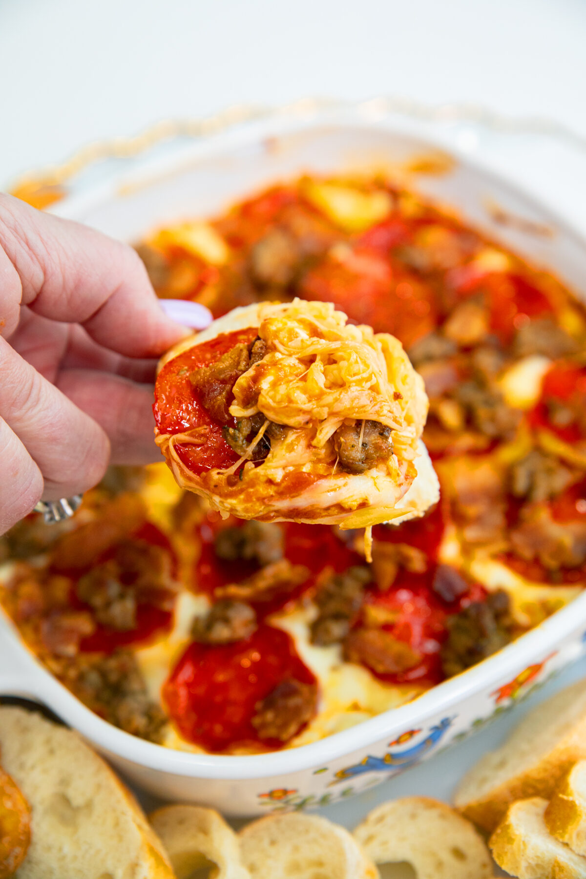 meat lover's pizza dip on a baguette